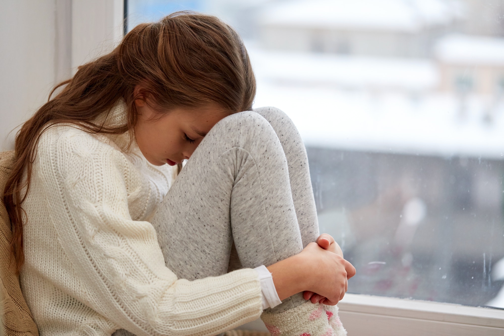 beautiful sad girl at home