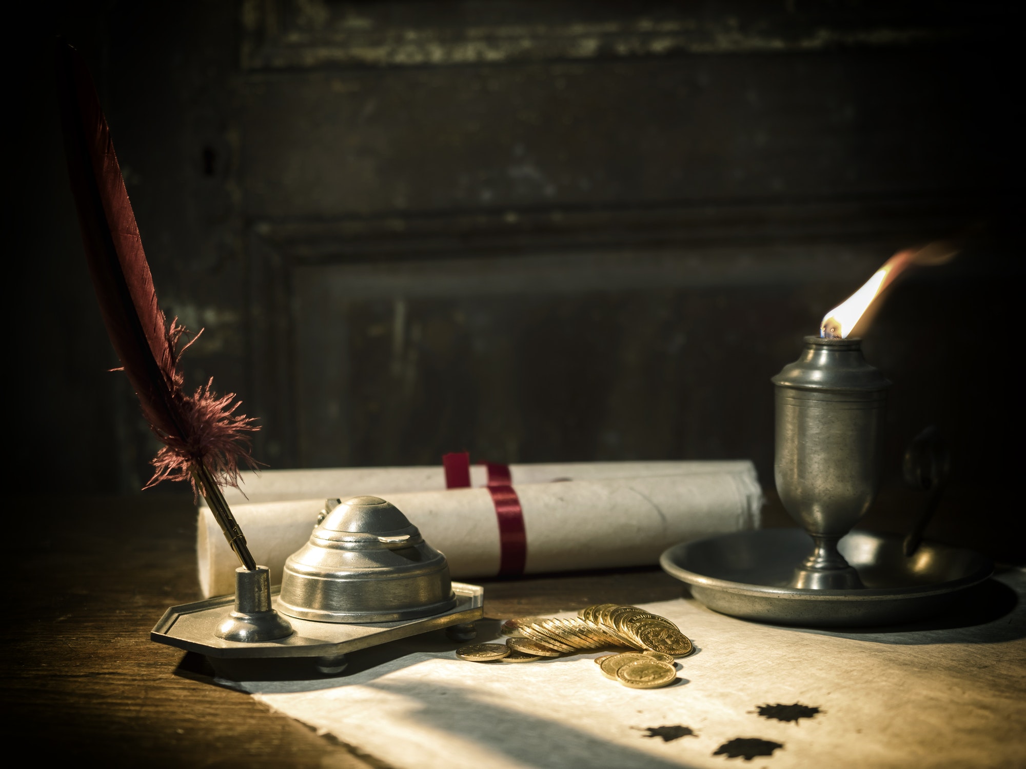 Antique parchment paper sheets lit by candlelight