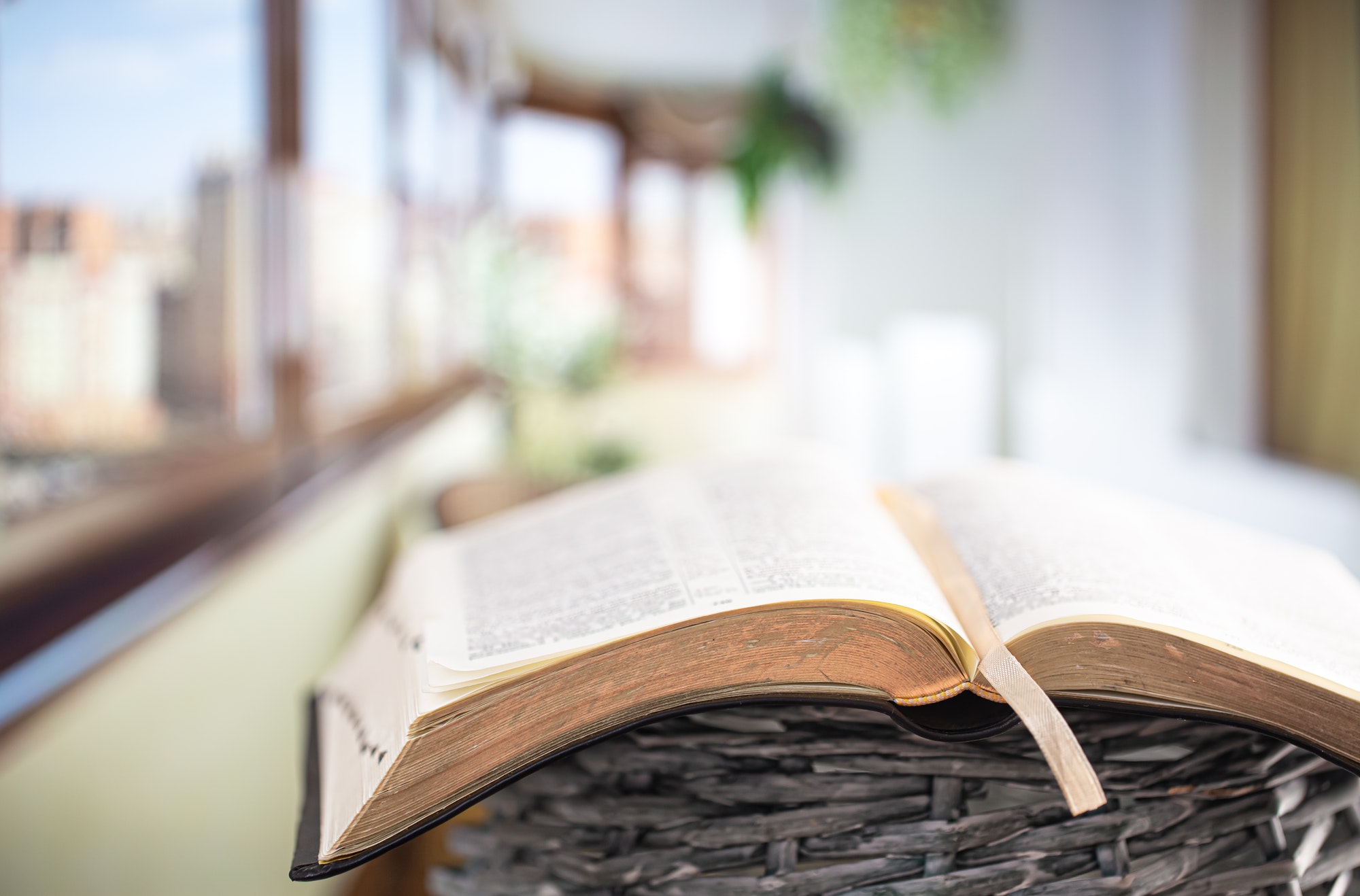 Book Bible close-up, on a beautiful terrace background. Morning time.