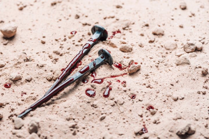 Bloody nails on ground. Banner. Copy space. Good friday. Passion, crucifixion of Jesus Christ